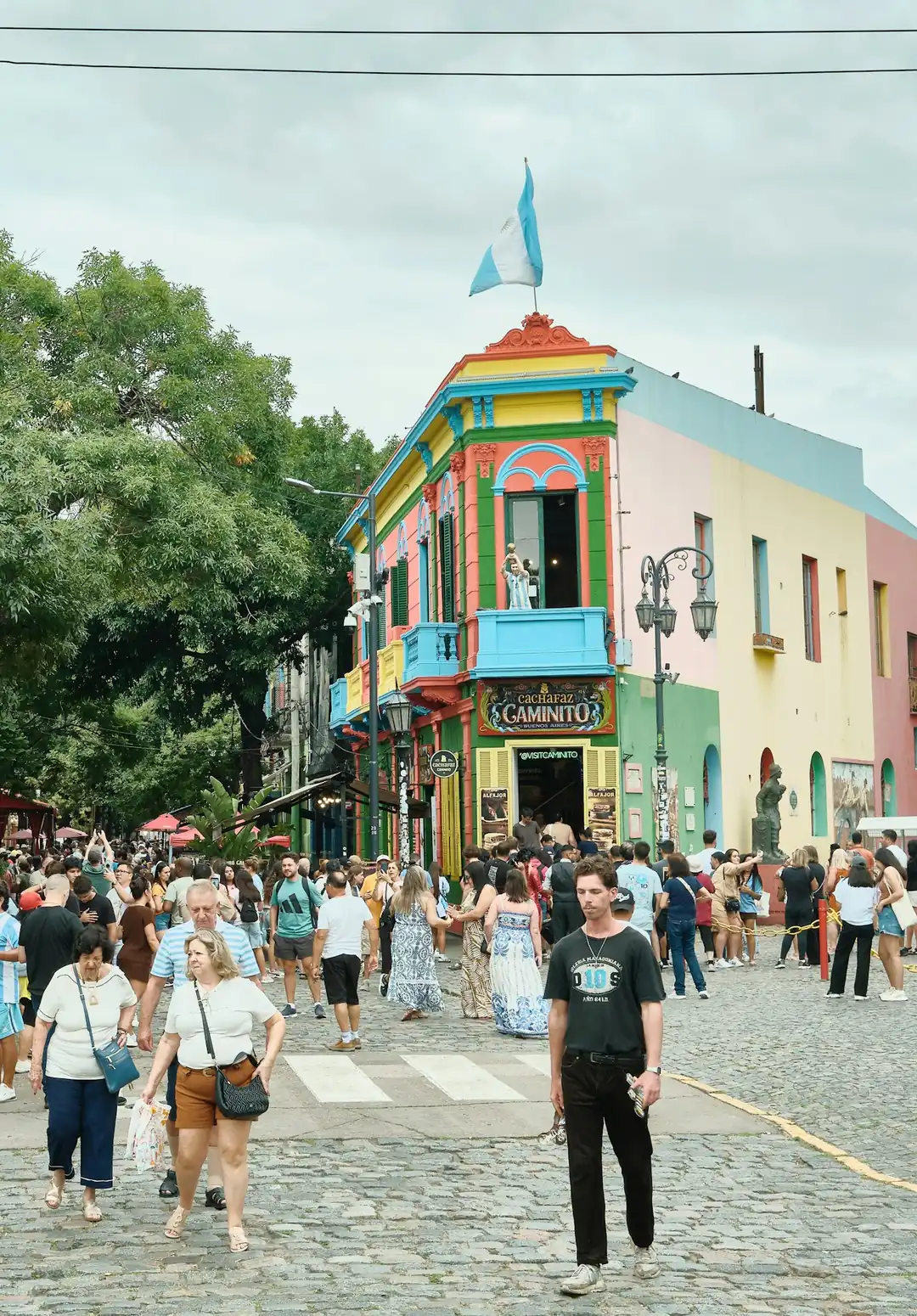 The brightly painted Caminito corner building with the Argentine flag in La Boca, Buenos Aires