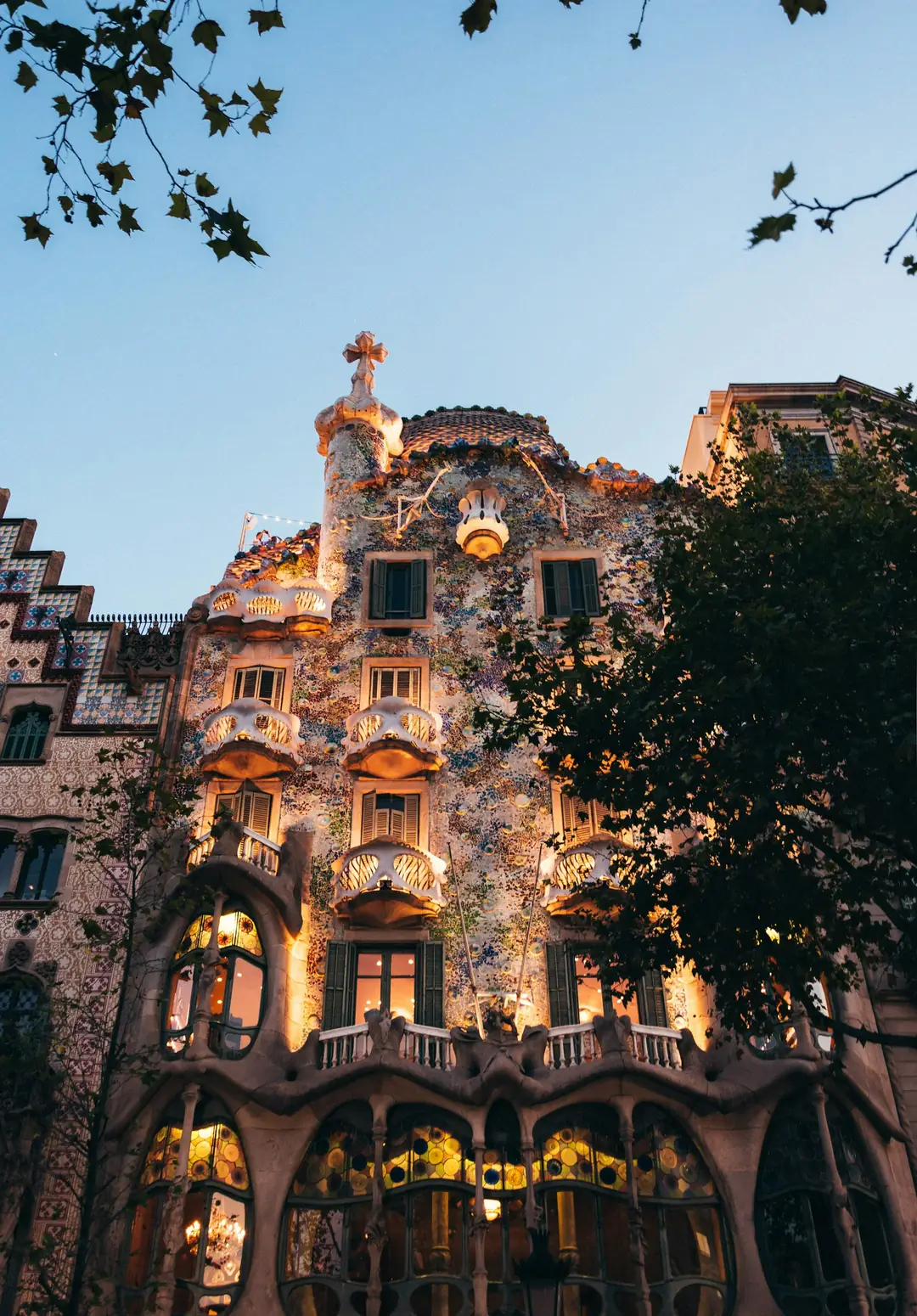 The illuminated Gaudí facade of Casa Batlló at dusk, Barcelona
